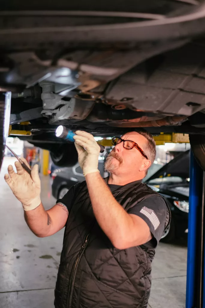 Mechanic looking at transmission in Calgary, AB