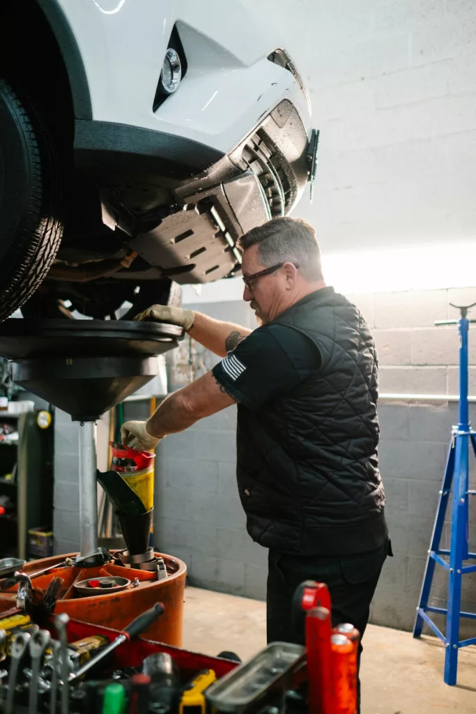 mechanic doing an oil change service in Calgary, AB
